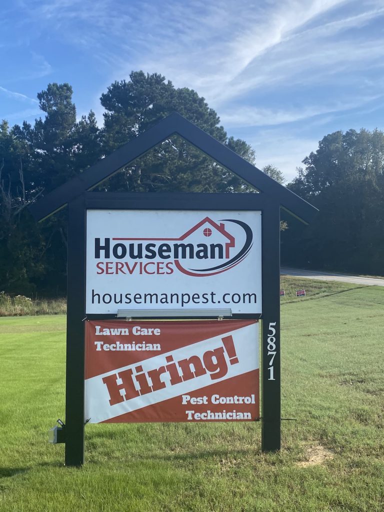 Hiring yard sign for Houseman Pest